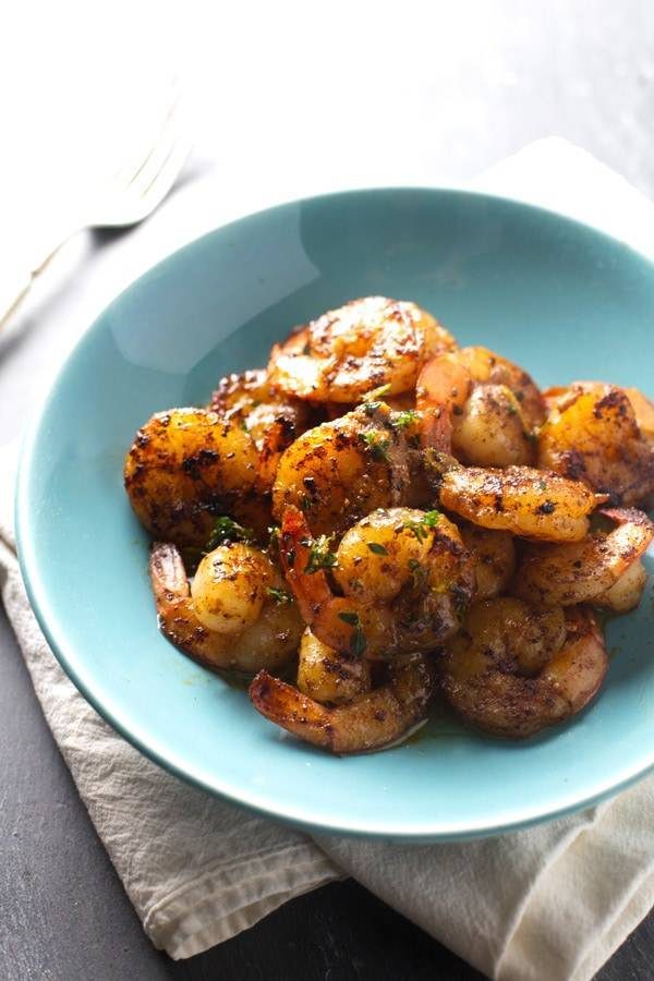 Orange Brown Butter Shrimp in a blue bowl.