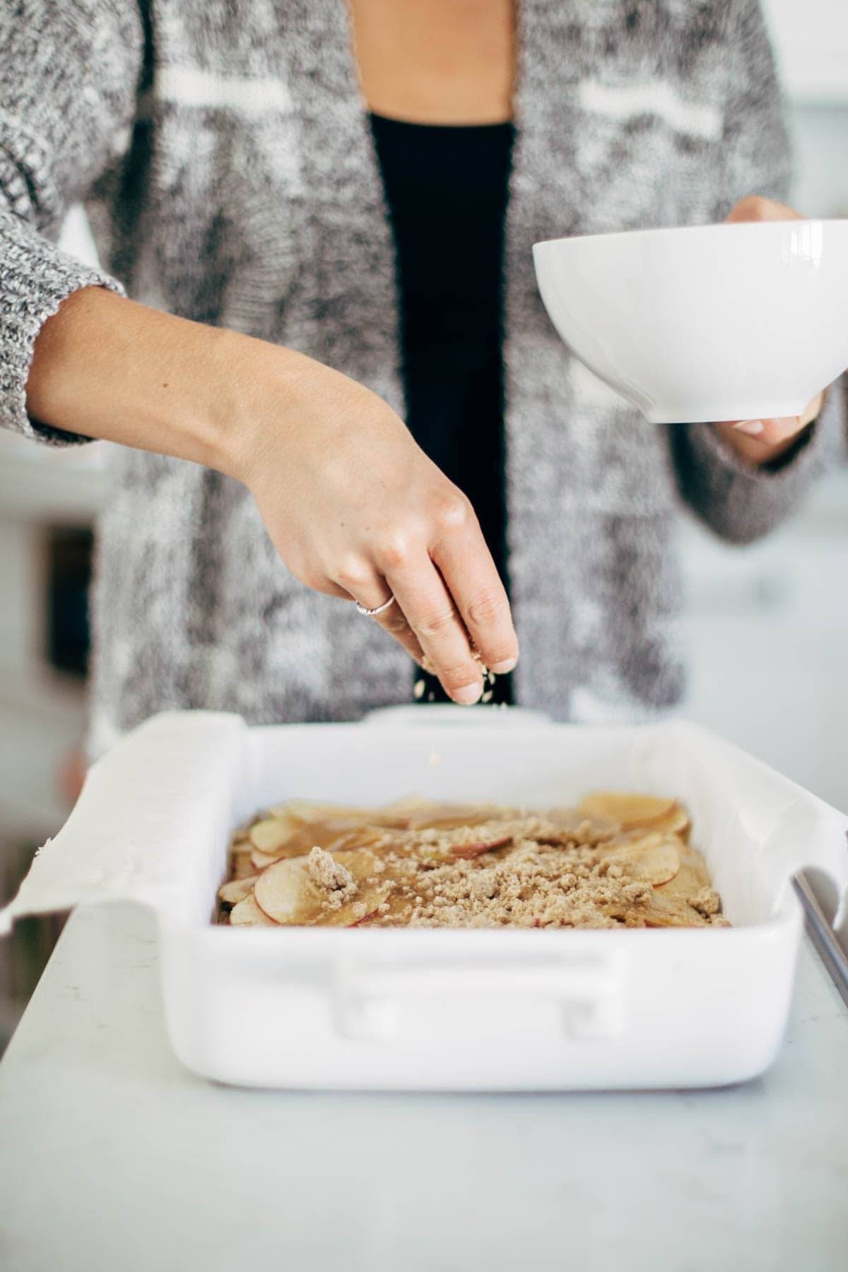 These layered bars are so simple! Loaded with homemade caramel and apples. Caramely apple layer tucked in by a brown sugar-y crust on both sides. | pinchofyum.com