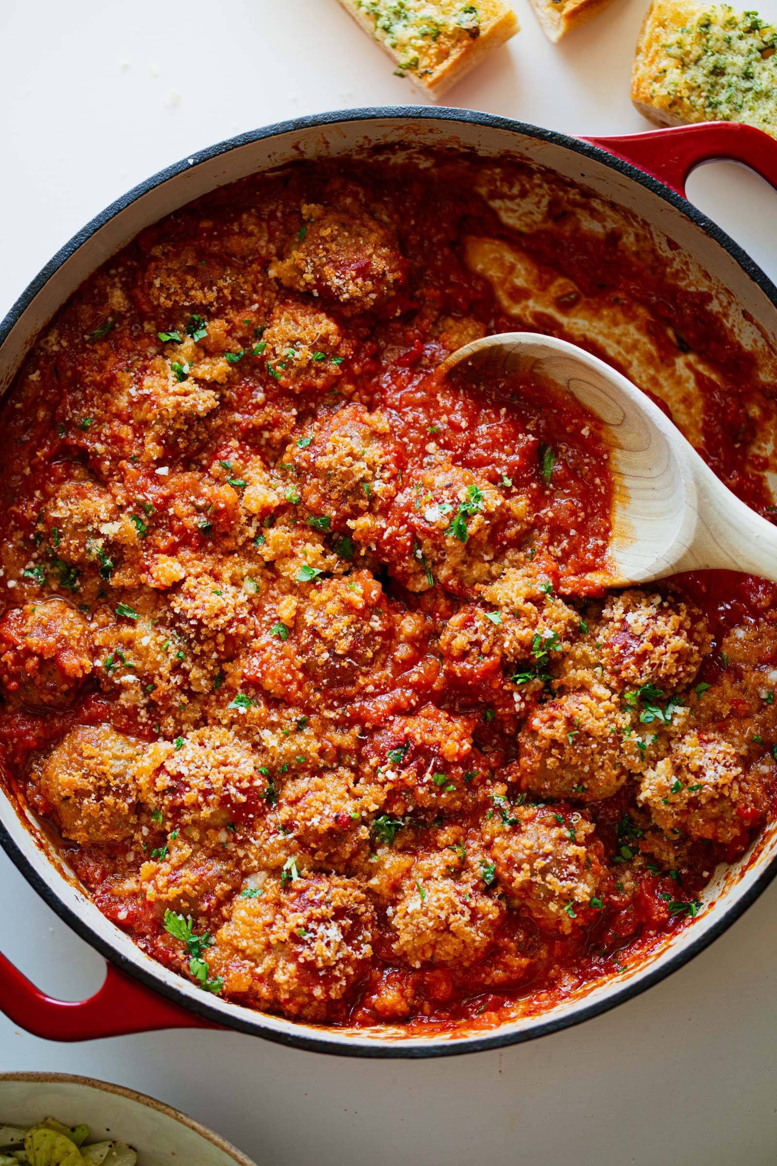 Ricotta meatballs in a skillet.
