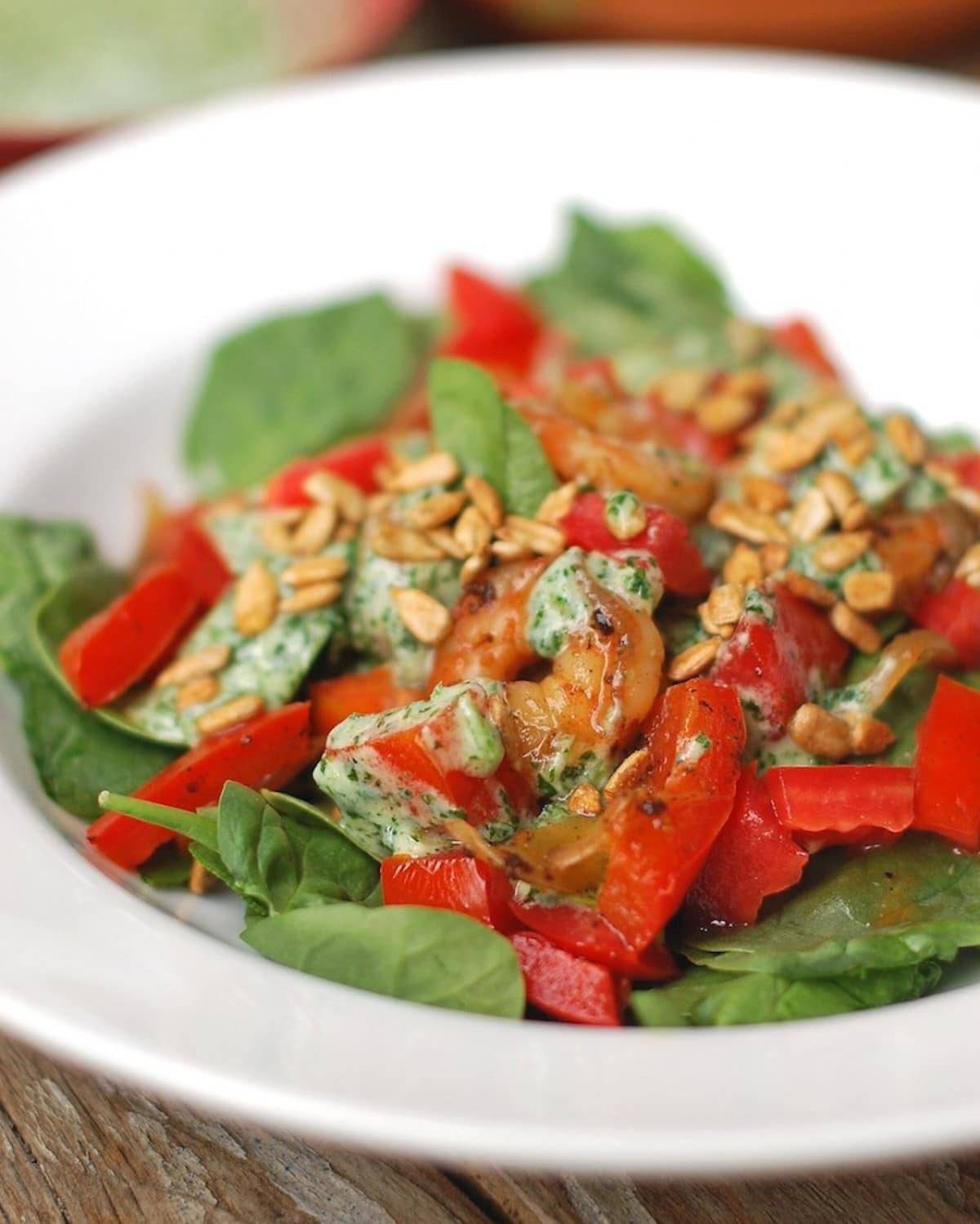 Creamy cilantro dressing on top of salad.
