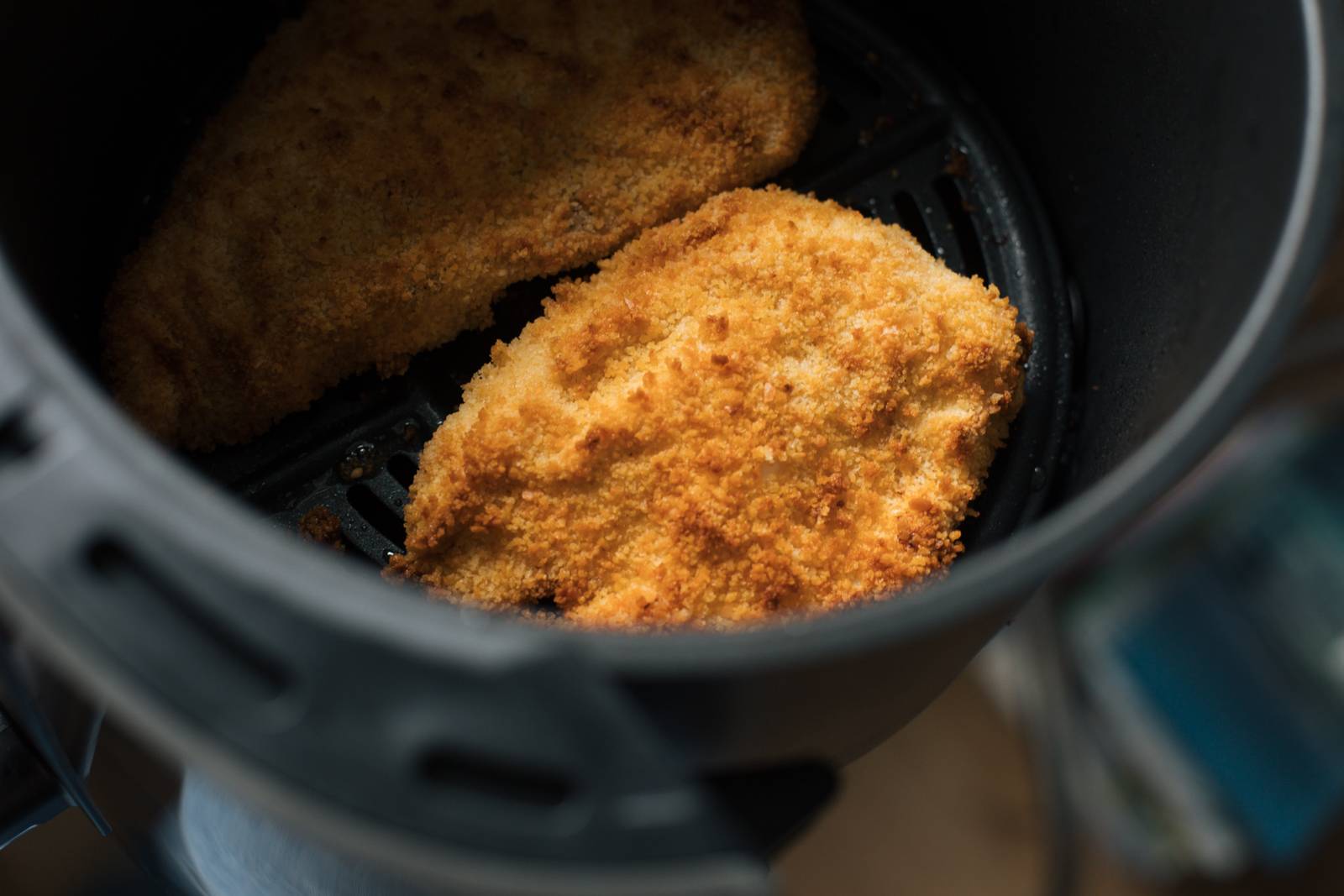 Crispy chicken cutlets in an air fryer.