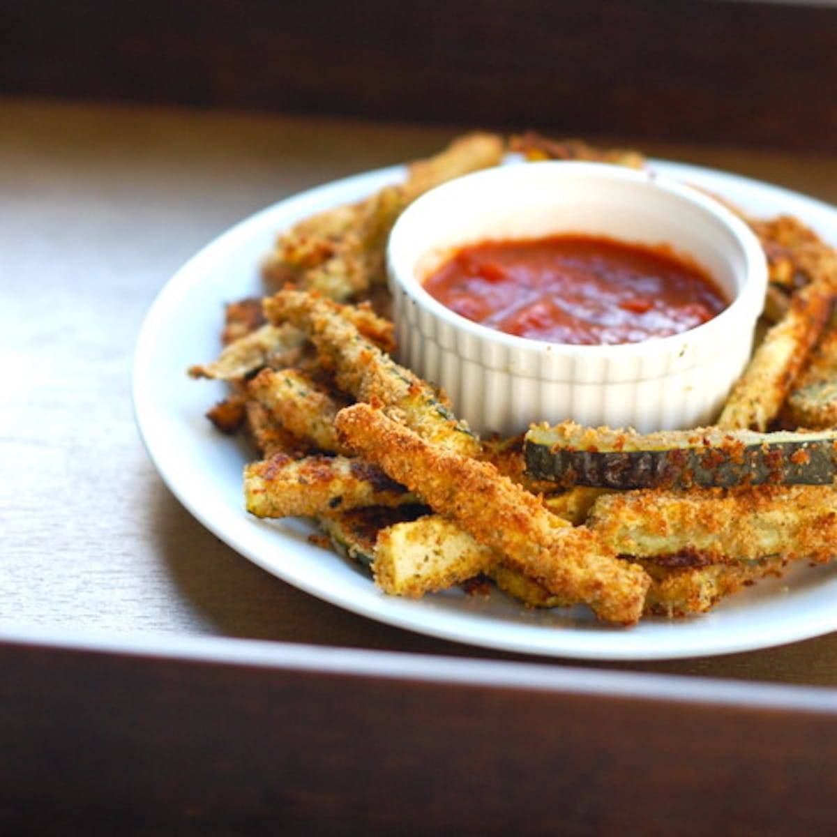 Baked zucchini fries with marinara sauce.