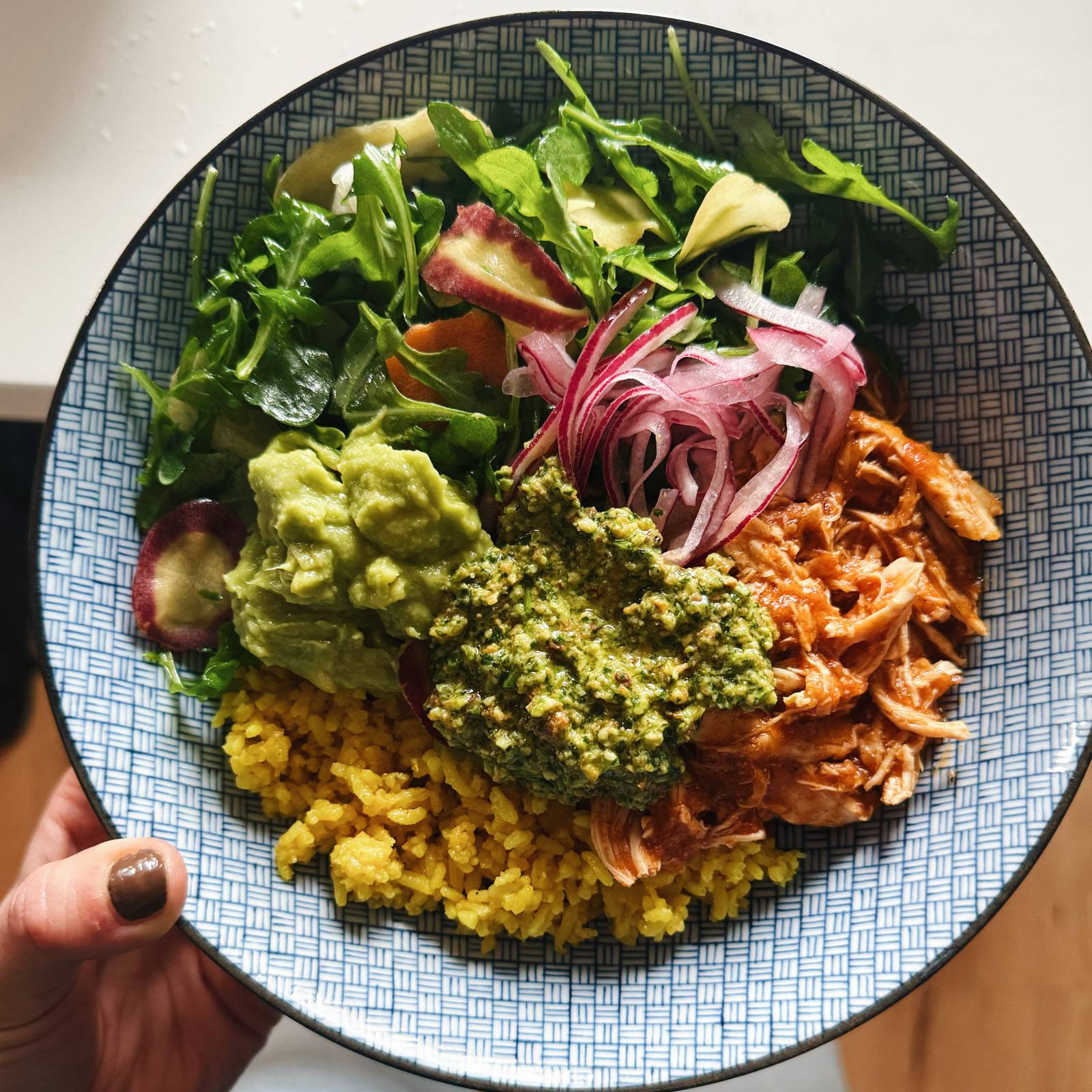Crockpot chicken bowls with yellow rice and cilantro pesto.