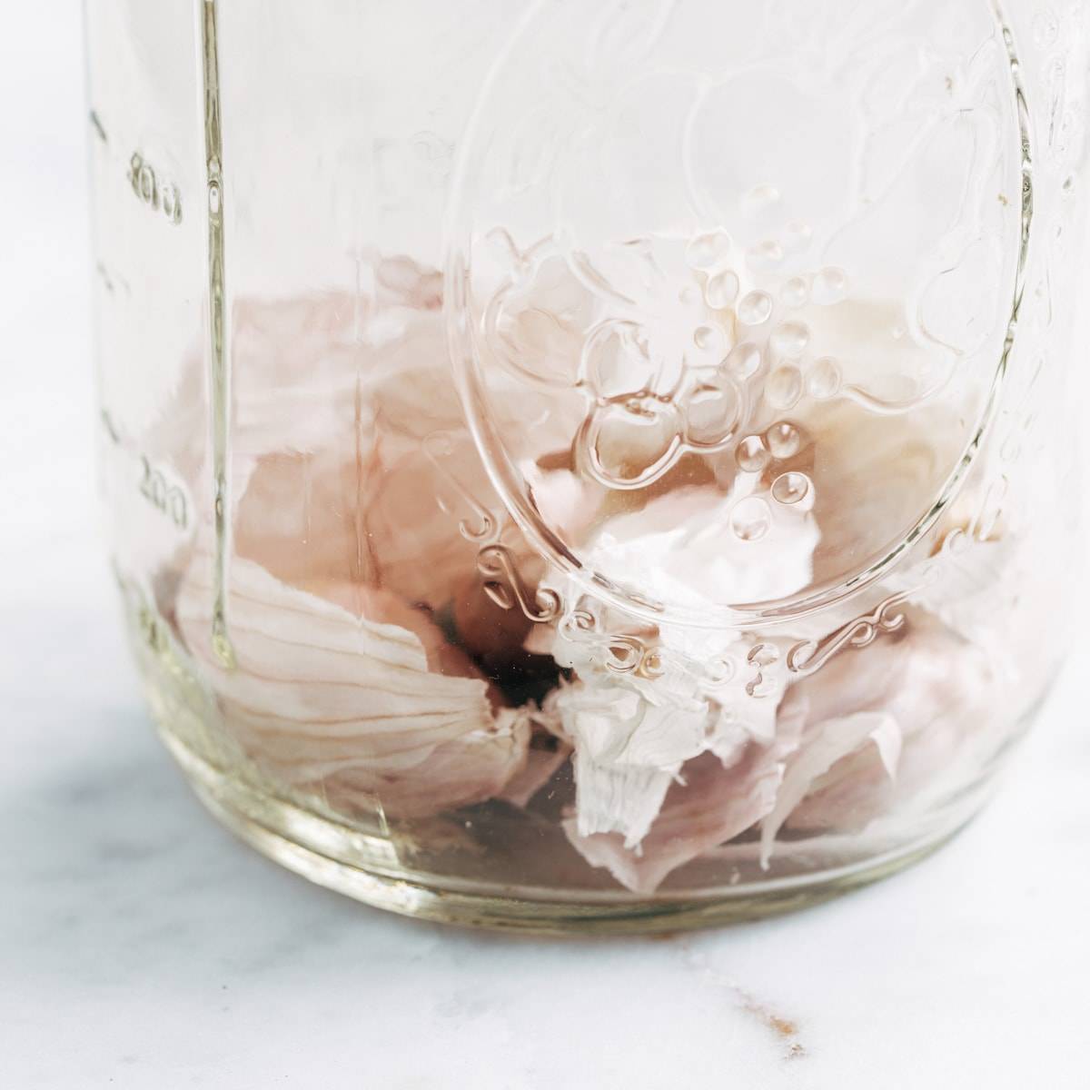 Garlic peels in a mason jar.