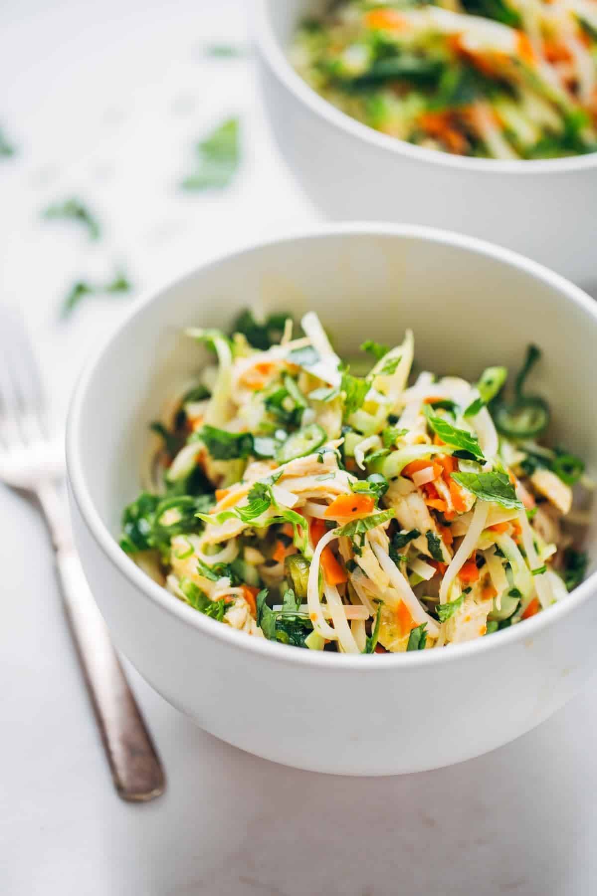 Vietnamese Chicken Salad with Rice Noodles in a white bowl.