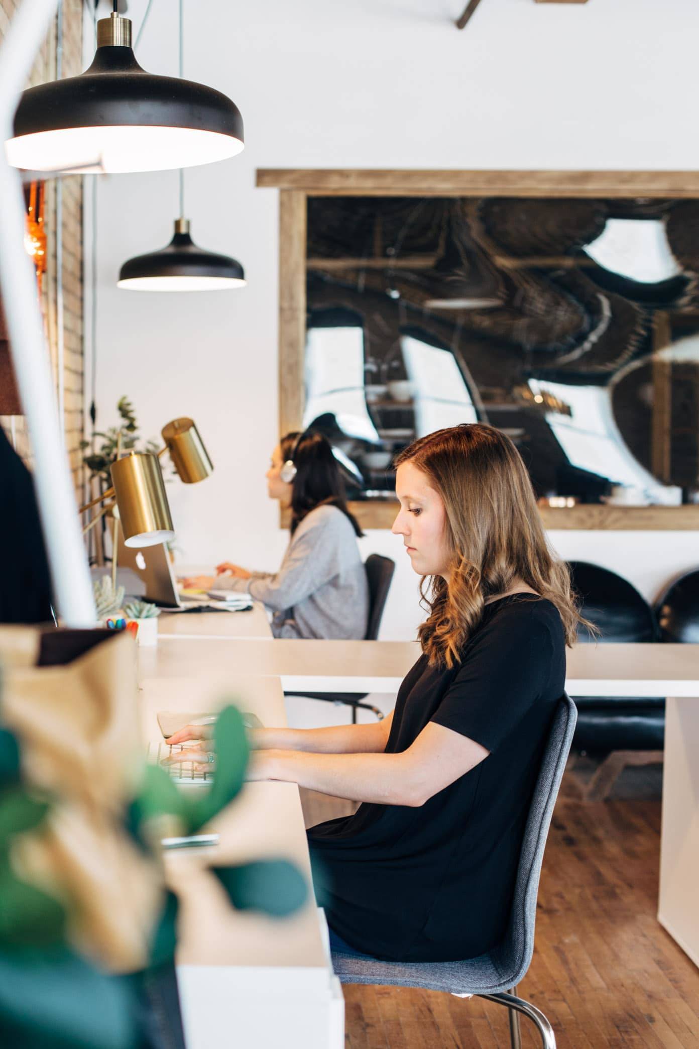 Women working at desks.