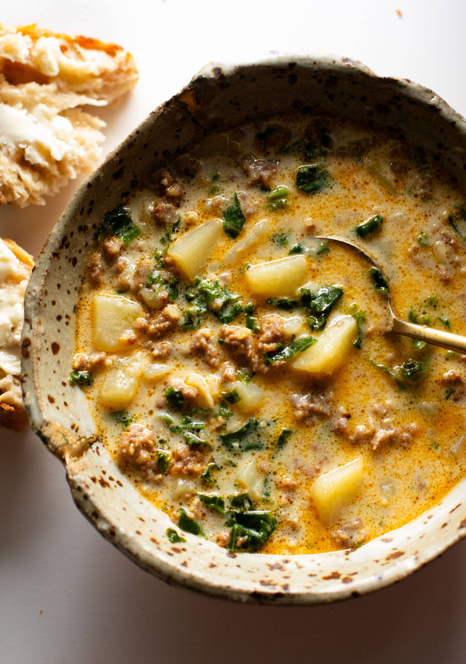 Zuppa Toscana in a bowl with bread