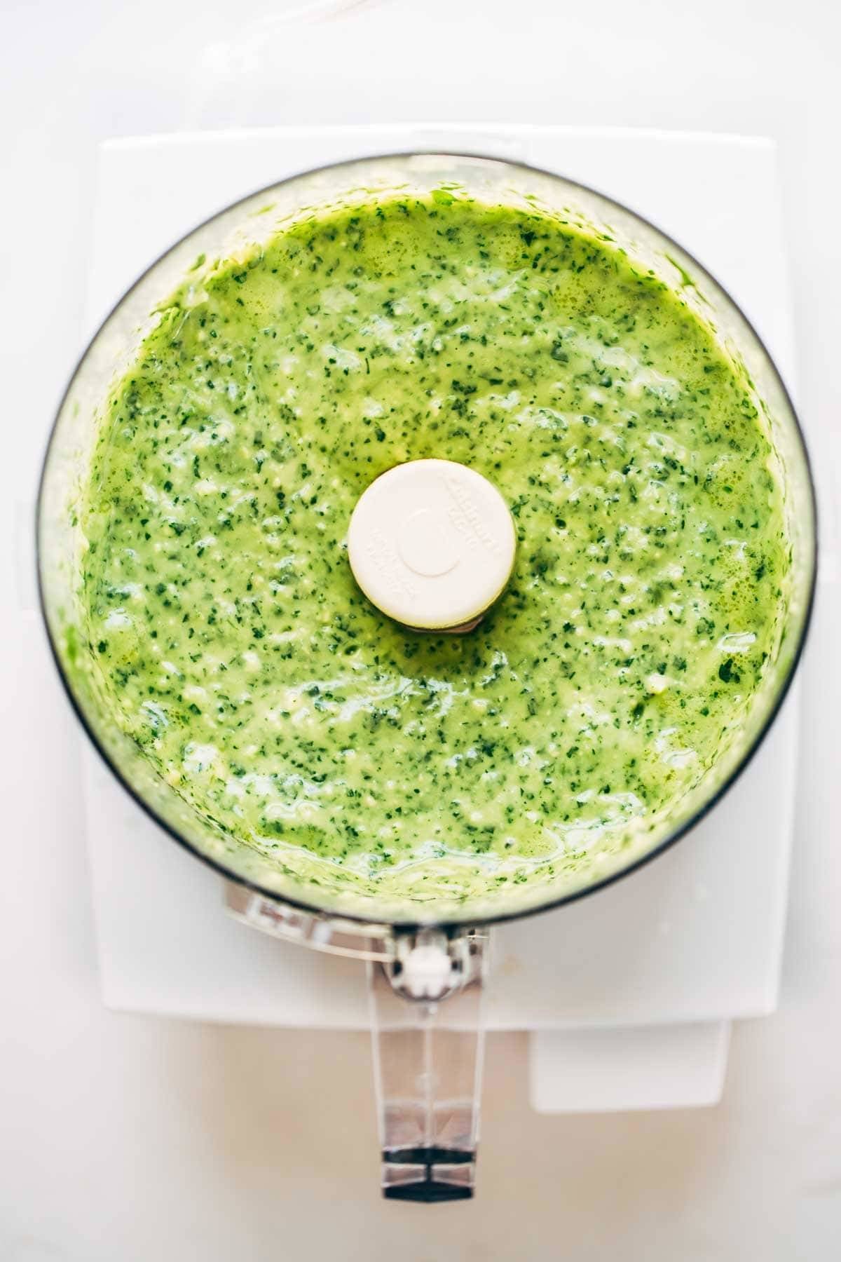Blended Magic Green Sauce in a food processor.